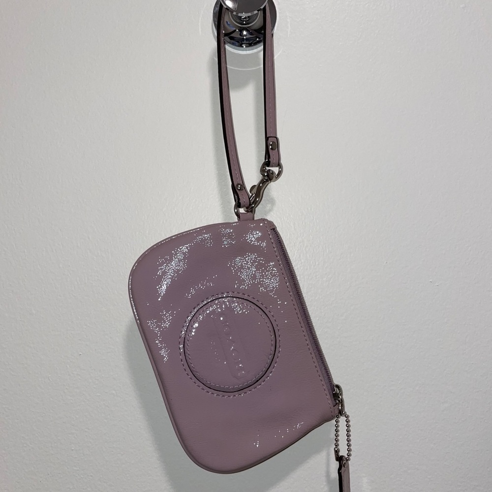 Mauve shiny textured patent leather Coach wristlet